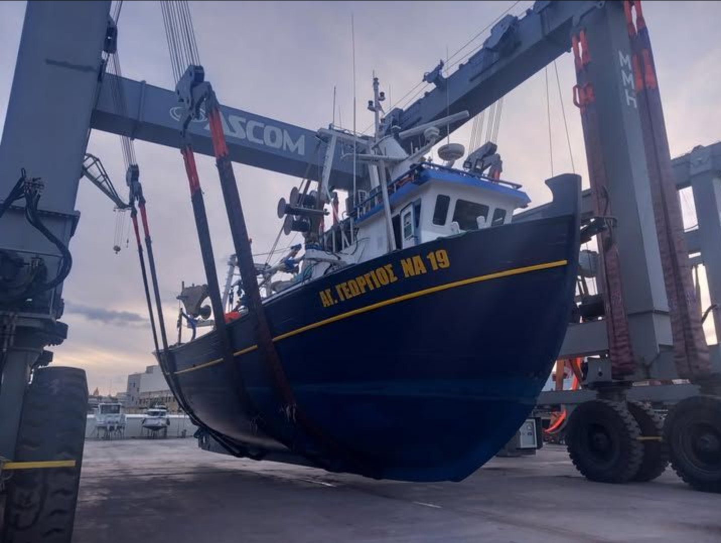 Fishing vessel lifted at a Malta shipyard Fishing vessel raised in a travel hoist for maintenance at a Malta shipyard